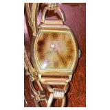 Antique Gruen wristwatch in vase engraved back