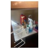 Shelf lot of cleaning supplies and laundry items