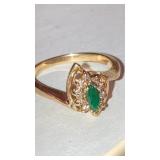Ladies ring w/ green and clear stones inside mark