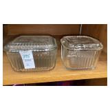 2 glass refrigerator boxes with lids. One with