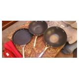 2 Calphalon woks, 1 with lid, and 1 grill pan
