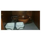 Shelf lot of serving dishes and wooden salad bowl