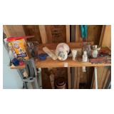 Contents of shelf, planters w rocks, dog gate,