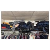 Top Shelf Of Womens Pants and Shirts