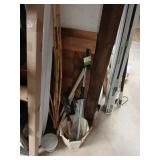 Corner lot of misc. garden rake, shovel, etc