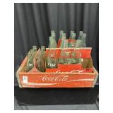 Coca Cola vintage wooden box and glass bottles