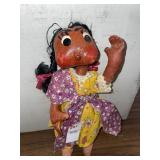 Handmade folk art doll, featuring a painted paper