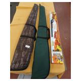 2 gun cases and empty Daisy Red Ryder box
