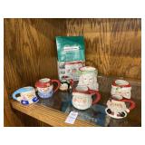 Santa Claus mug and Santa/snowman candleholders