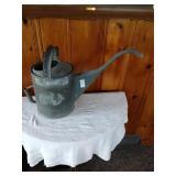 Vintage galvanized water can