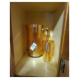 Amber Marigold Carnival glass pitcher textured