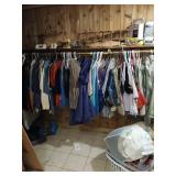 All clothing on hangers in closet