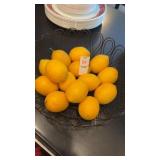 Metal display bowl with fake lemons