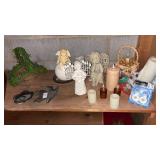 Shelf lot of angel figurines, candles, and other