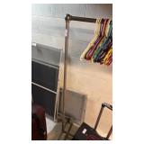 Metal rack on wheels for clothing and hangers