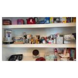 Lot of glass jars, canned goods, and other items