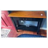 Two-tone console table with black finish and