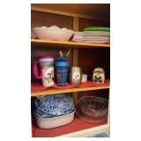 Cabinet lot of casserole dishes, cups, and plates