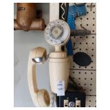 Vintage rotary phone on wall
