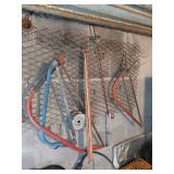Lot of saws etc hanging on wall