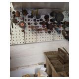 Contents of bench top and grind wheels on wall