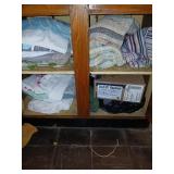 Cabinet lot of braided rugs and misc
