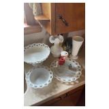 Variety of milk glass bowls, plates, and vases