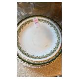 Variety of vintage plates, anniversary wine