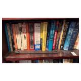 3 shelves of books, Tom Clancy, Seventh Scroll,