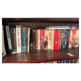 3 shelves of books, Love and War, Tom Clancy,