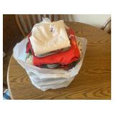 Bag of tea towels, potholders, kitchen linens