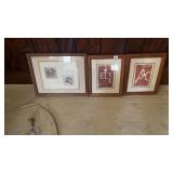 Framed Hawaiian petroglyph figures