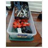 Bin of power adapters, scissors etc
