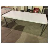Folding table with metal base