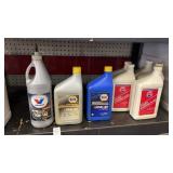 Shelf of Assorted Oil, Power Steering Fluid, and