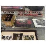 Shelf lot of Coke Bottles, Porsche Poster, Ford