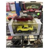Yellow and maroon Porsche 911 Carrera RS 2.7