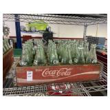 Vintage wooden Coca-Cola crate filled with green