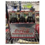 vintage Coca-Cola 6-pack carrier with a metal tin