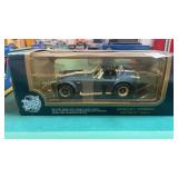 1/18 scale diecast model of a 1964 Shelby Cobra