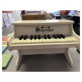 white Schoenhut toy piano