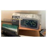Assortment of Radios and Clocks with escape