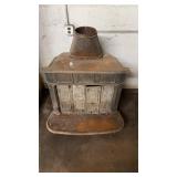 Antique cast iron franklin wood stove