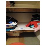 Shelf of womens clothes some new
