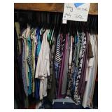 Lot of clothes on hangers in closet only