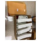 Box of File Folders and Plastic Shovels