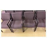 Wooden armchairs with upholstered padded seats