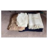 Assortment of blankets, sheets, and curtains