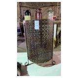 Vintage pierced metal cylindrical garbage can