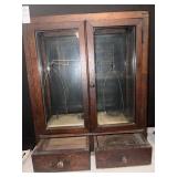 Vintage wooden display cabinet with enclosed